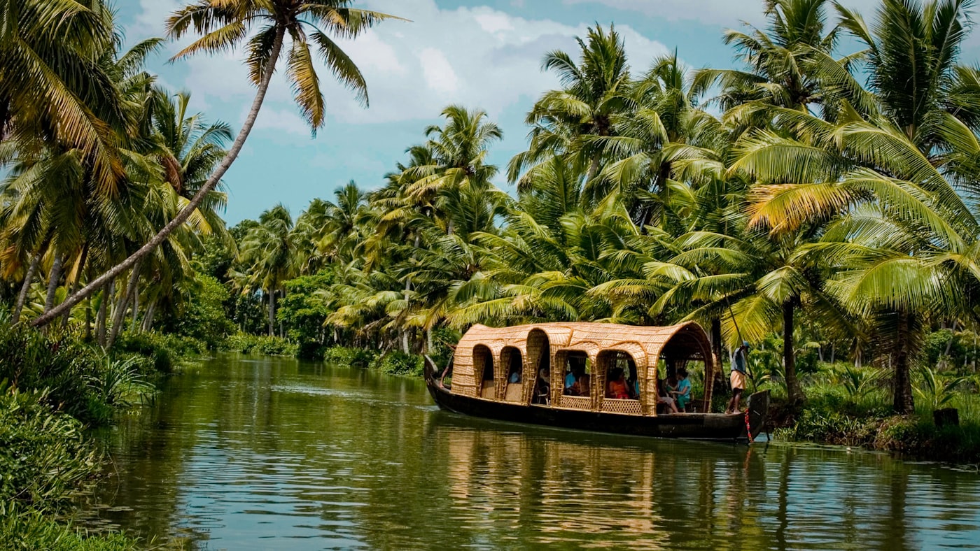 Kerala backwater landscape with houseboat